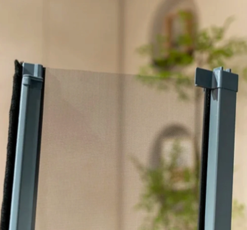 Close view of a smooth retractable insect mesh frame in a bathroom